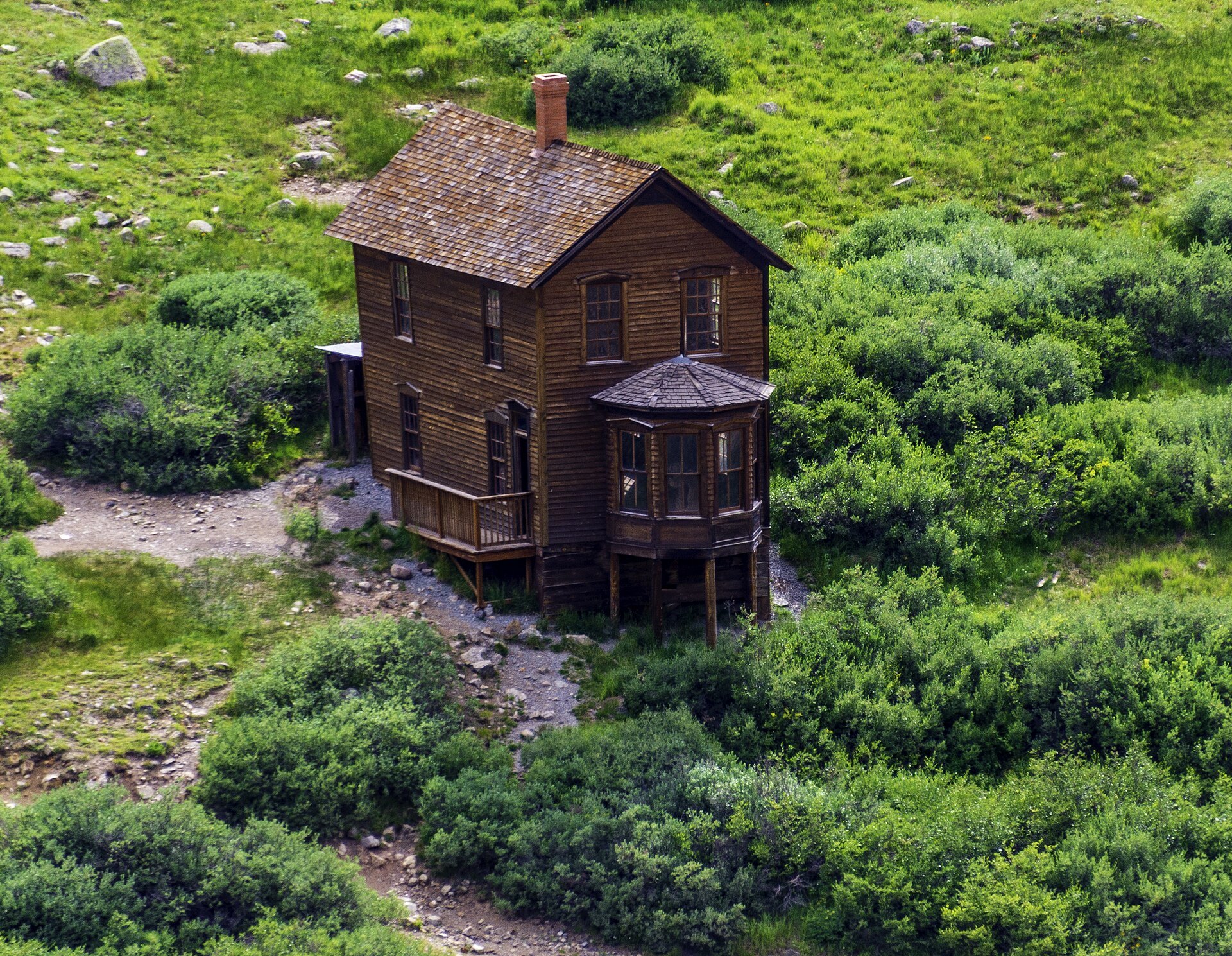 Two-story Duncan House with its bay window at Animas Forks