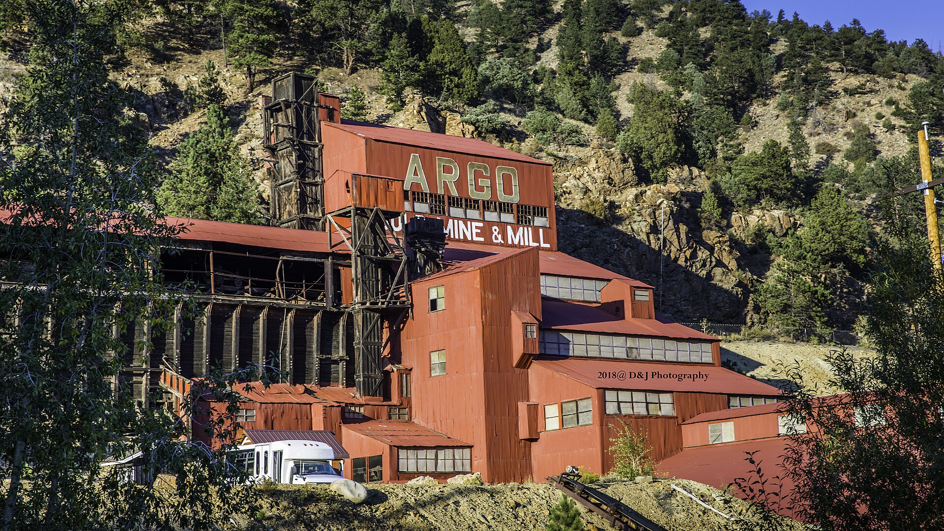 The red Argo Gold Mill climbing the hillside in Idaho Springs