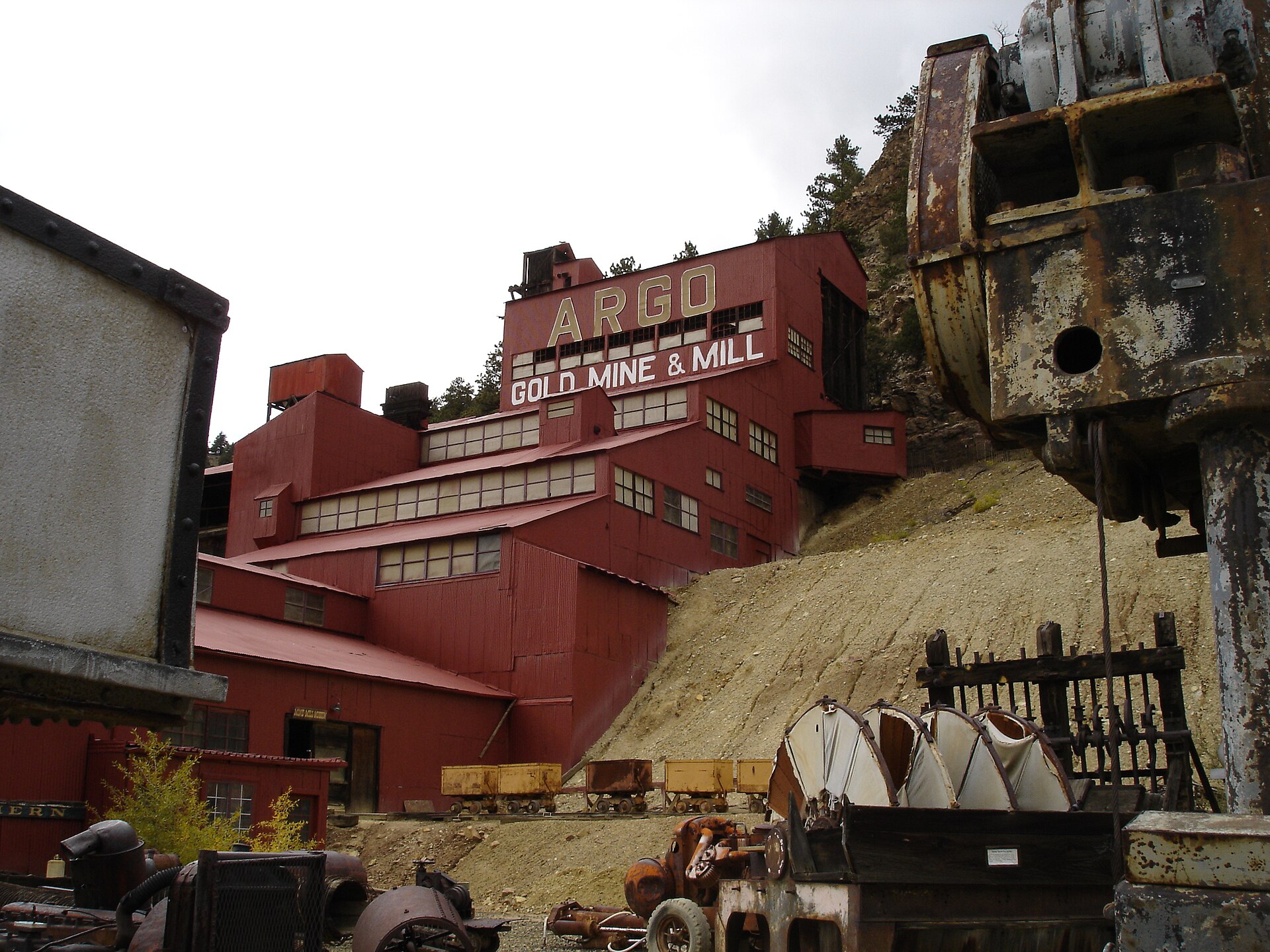 Historic mining equipment in front of the Argo Mill