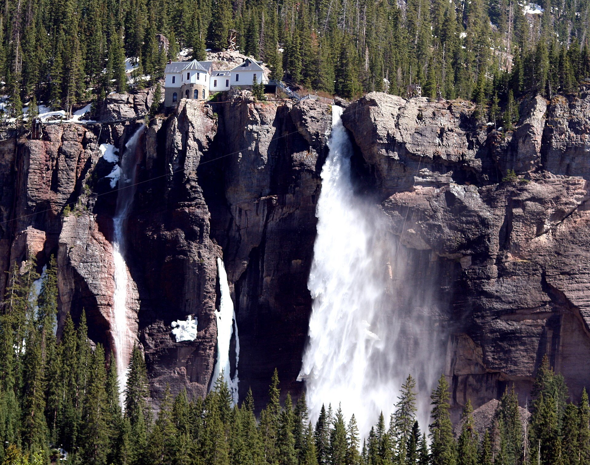 Bridal Veil Falls pouring 365 feet below the historic power plant in Telluride, Colorado
