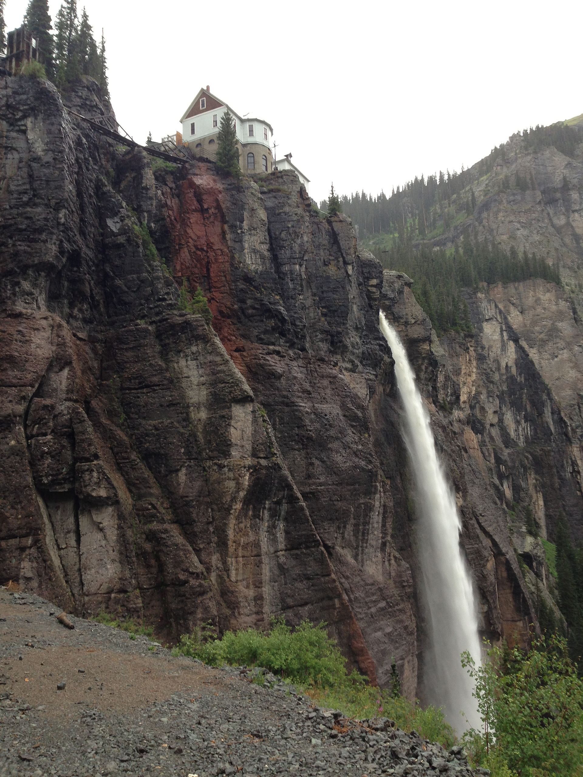 Bridal Veil Falls dropping down the cliffs at the end of Telluride's box canyon