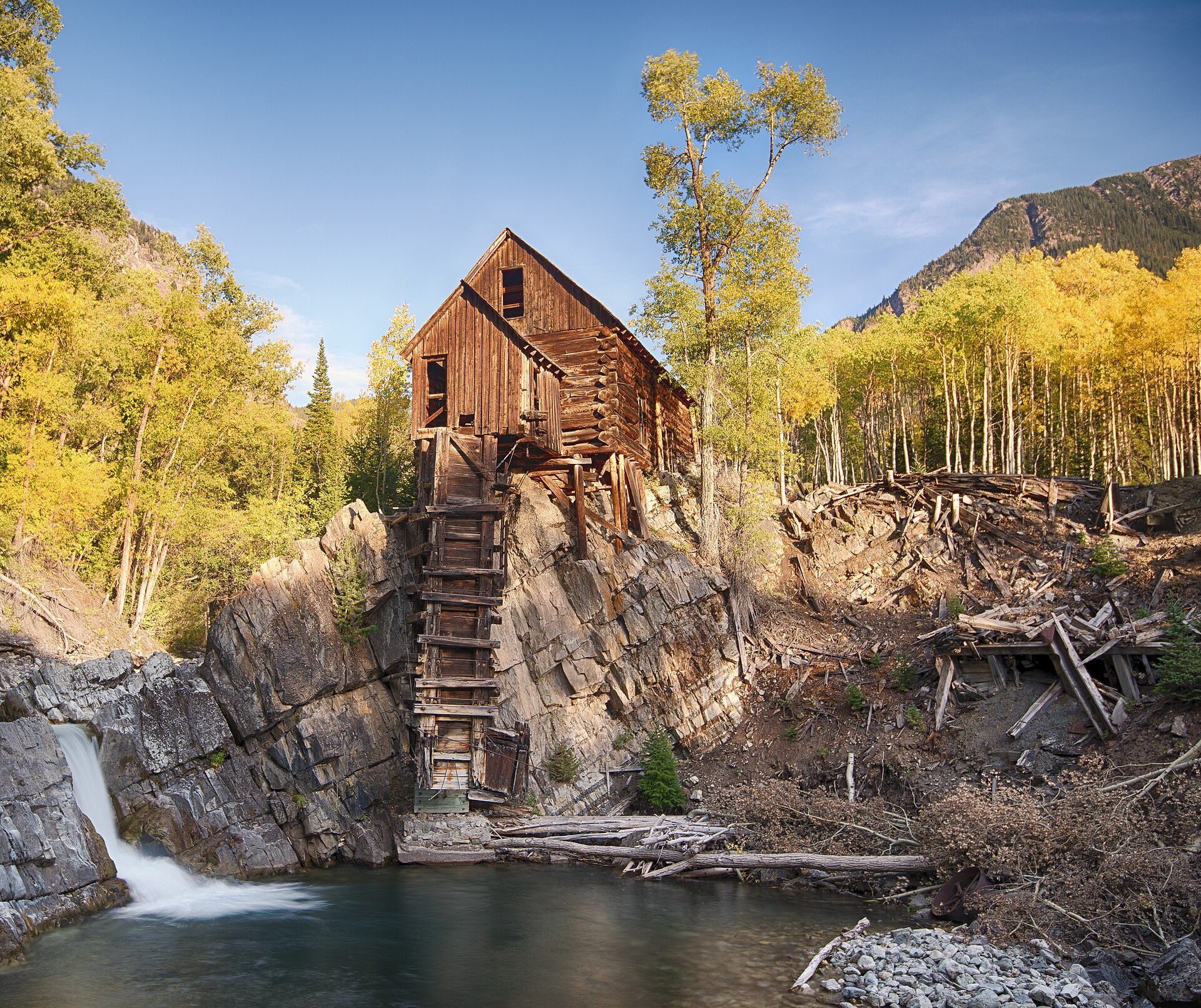 Crystal Mill in autumn with golden aspens above the river