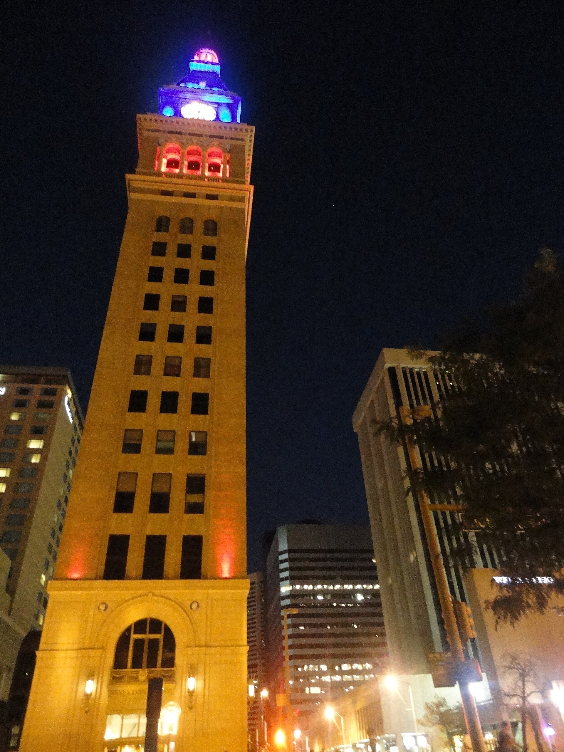Daniels & Fisher Tower lit up at night on 16th Street in Denver