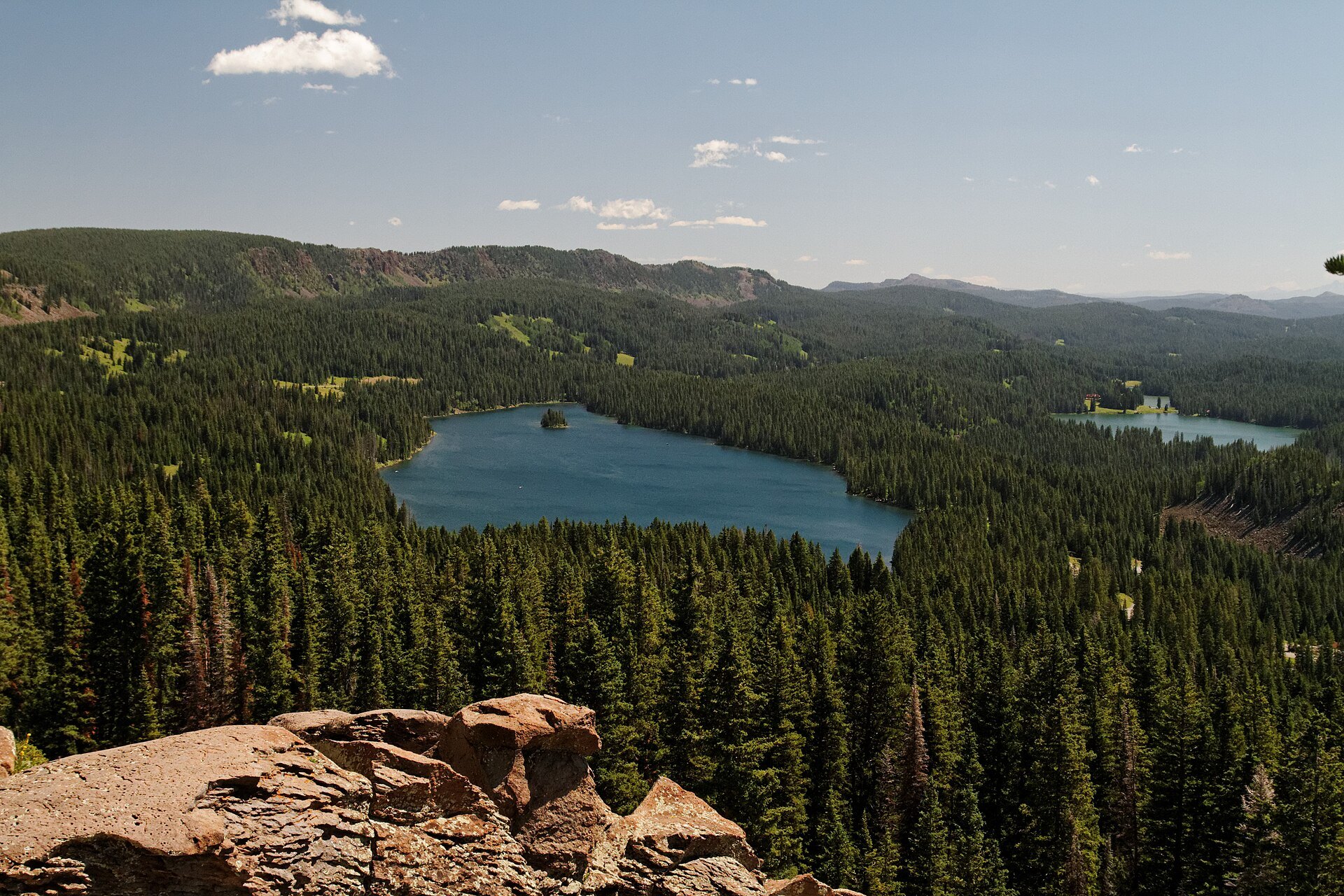 Lake surrounded by forest seen from the rim of Grand Mesa, Colorado