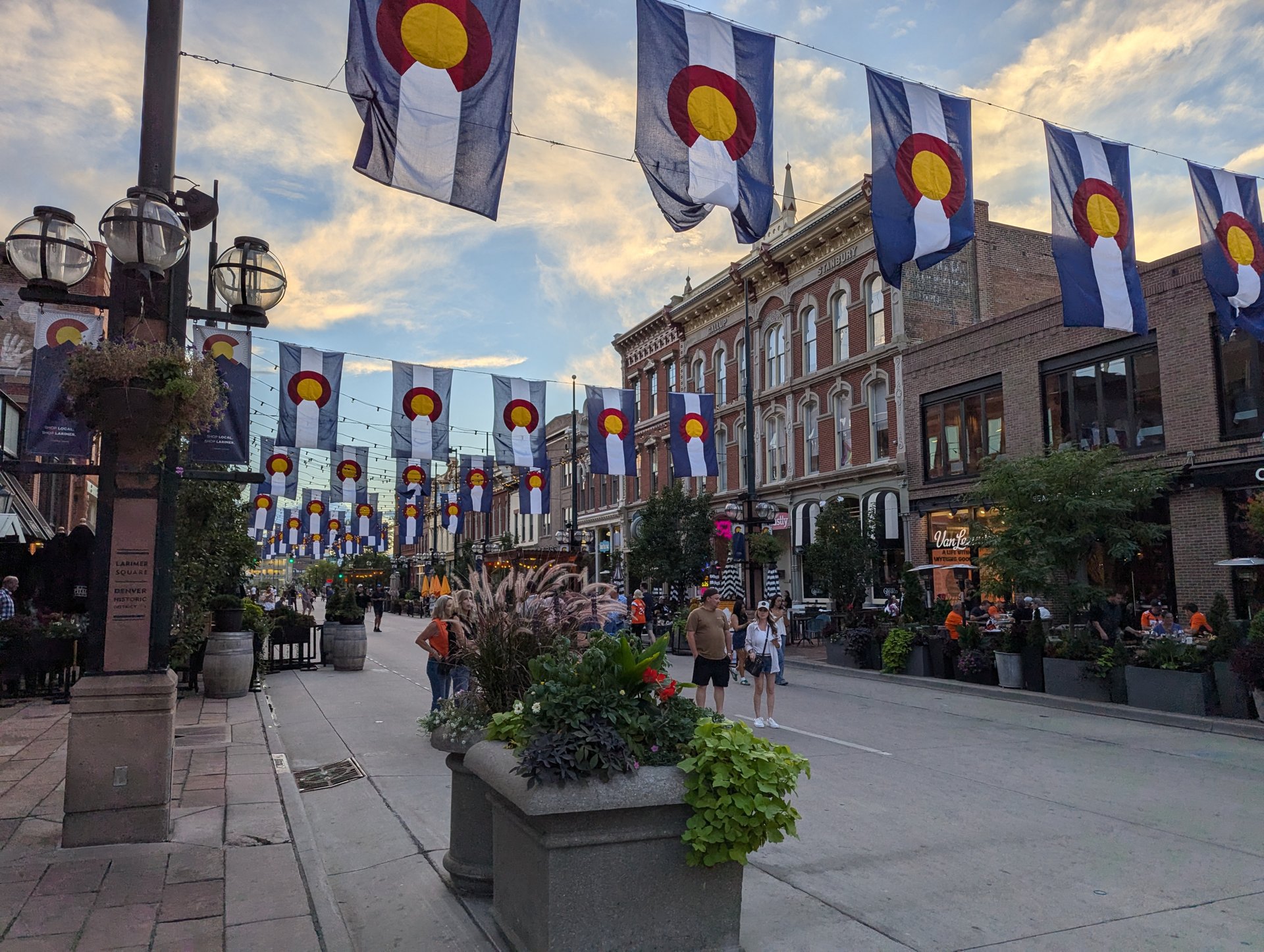 Flowers and Colorado flag banners at Larimer Square