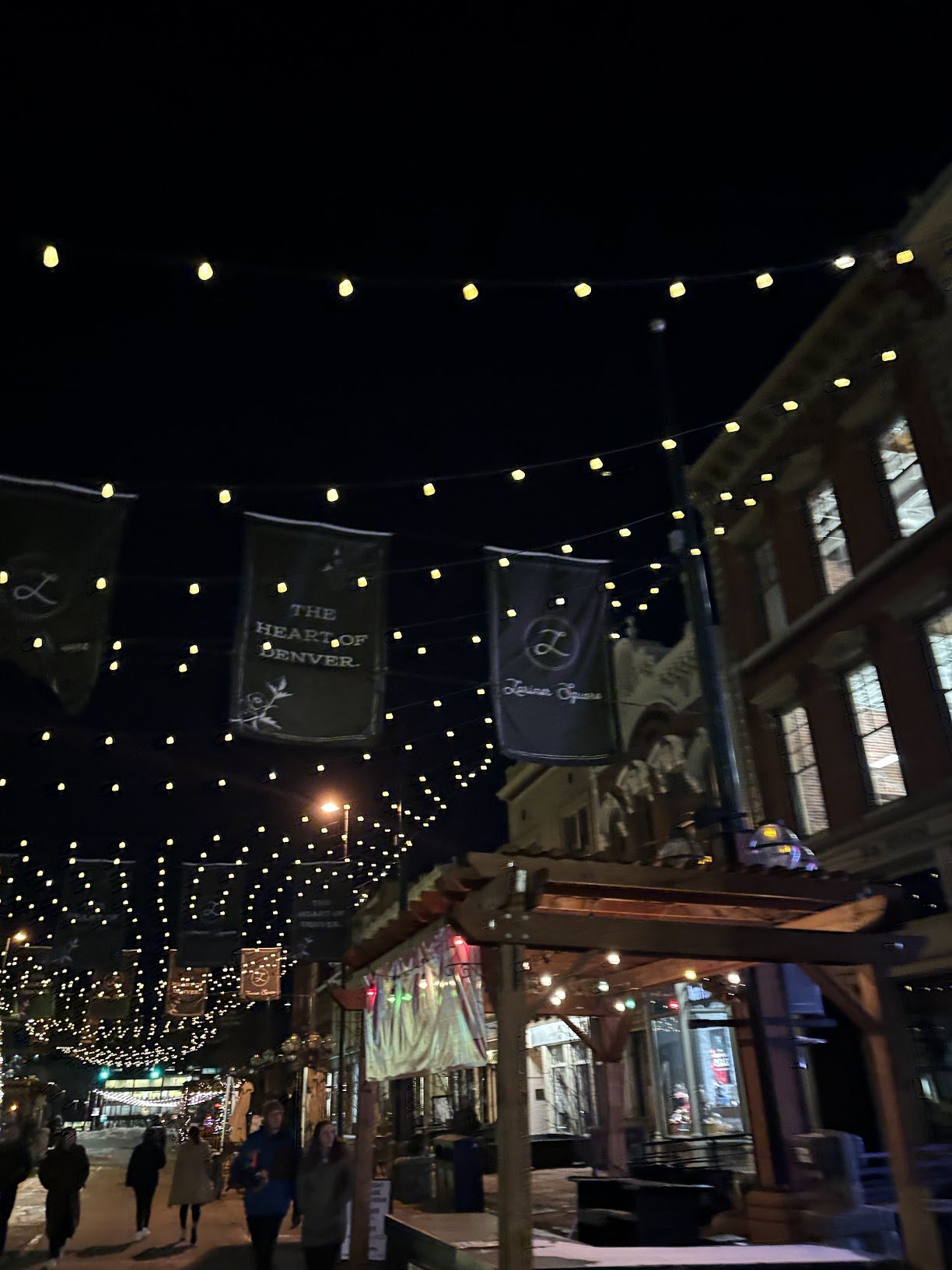 String lights over Larimer Square at night
