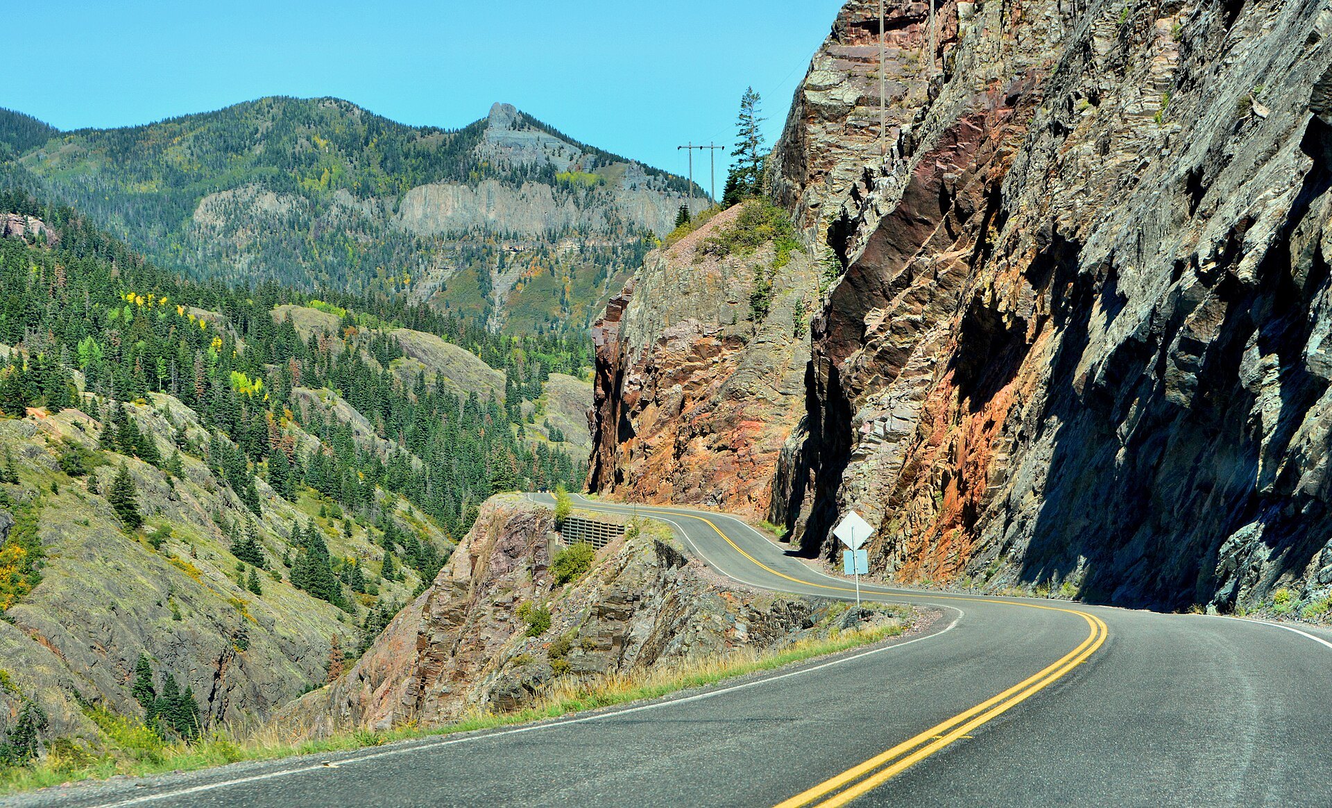 US Highway 550 Million Dollar Highway curving past rock cliffs between Silverton and Ouray, Colorado