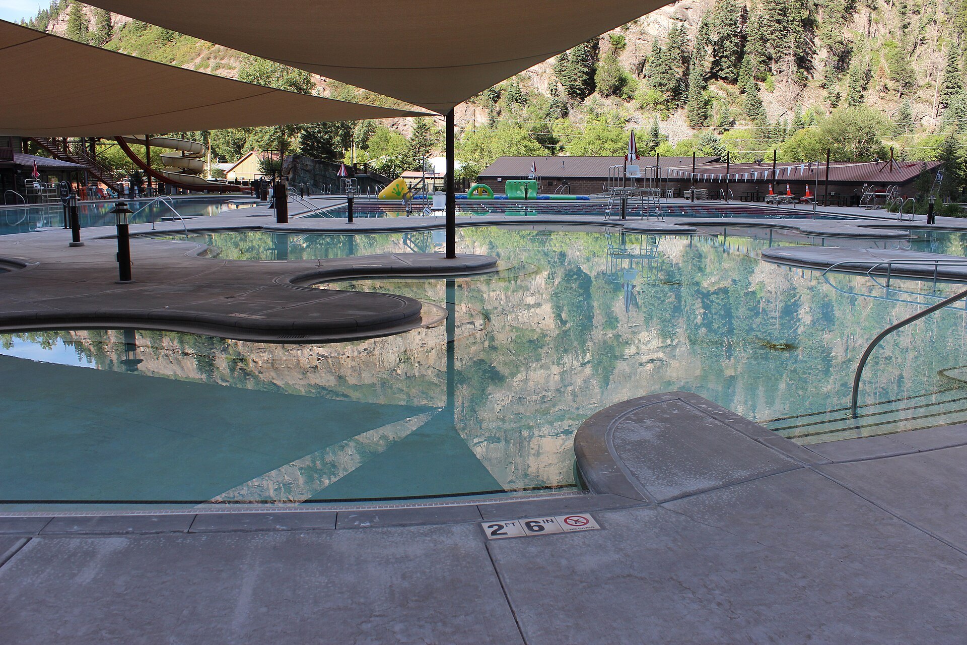The renovated Ouray Hot Springs Pool with mountains above, Ouray, Colorado