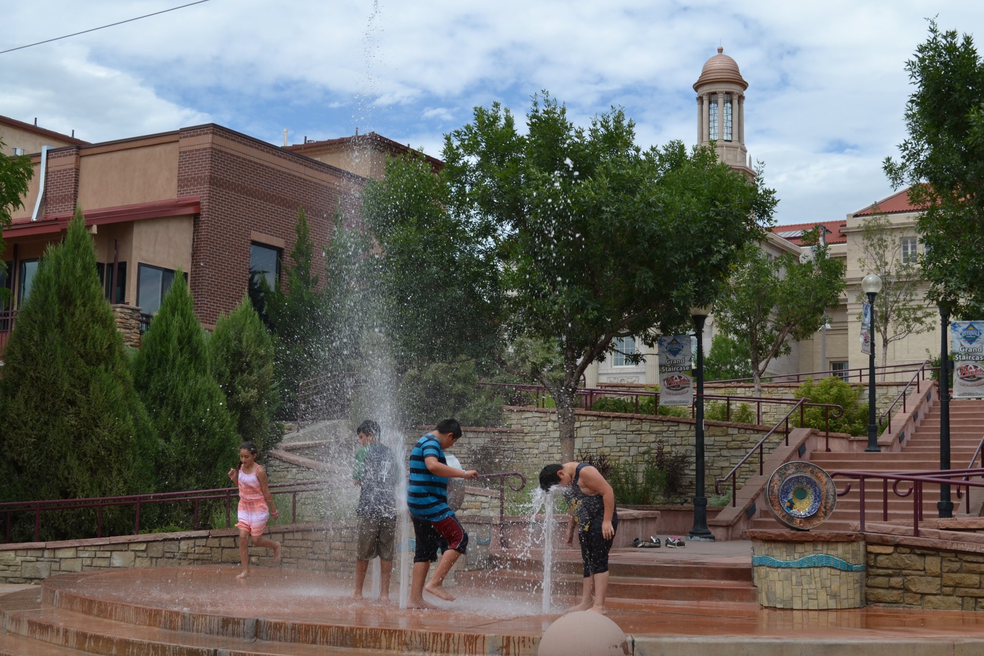 Children playing in the Pueblo Riverwalk fountain