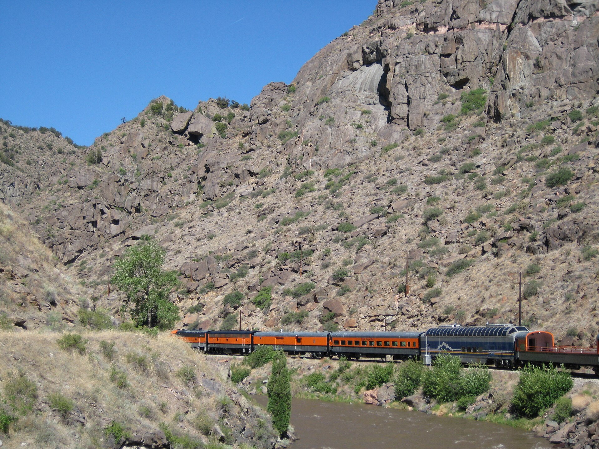 Royal Gorge Route train winding below rocky canyon slopes