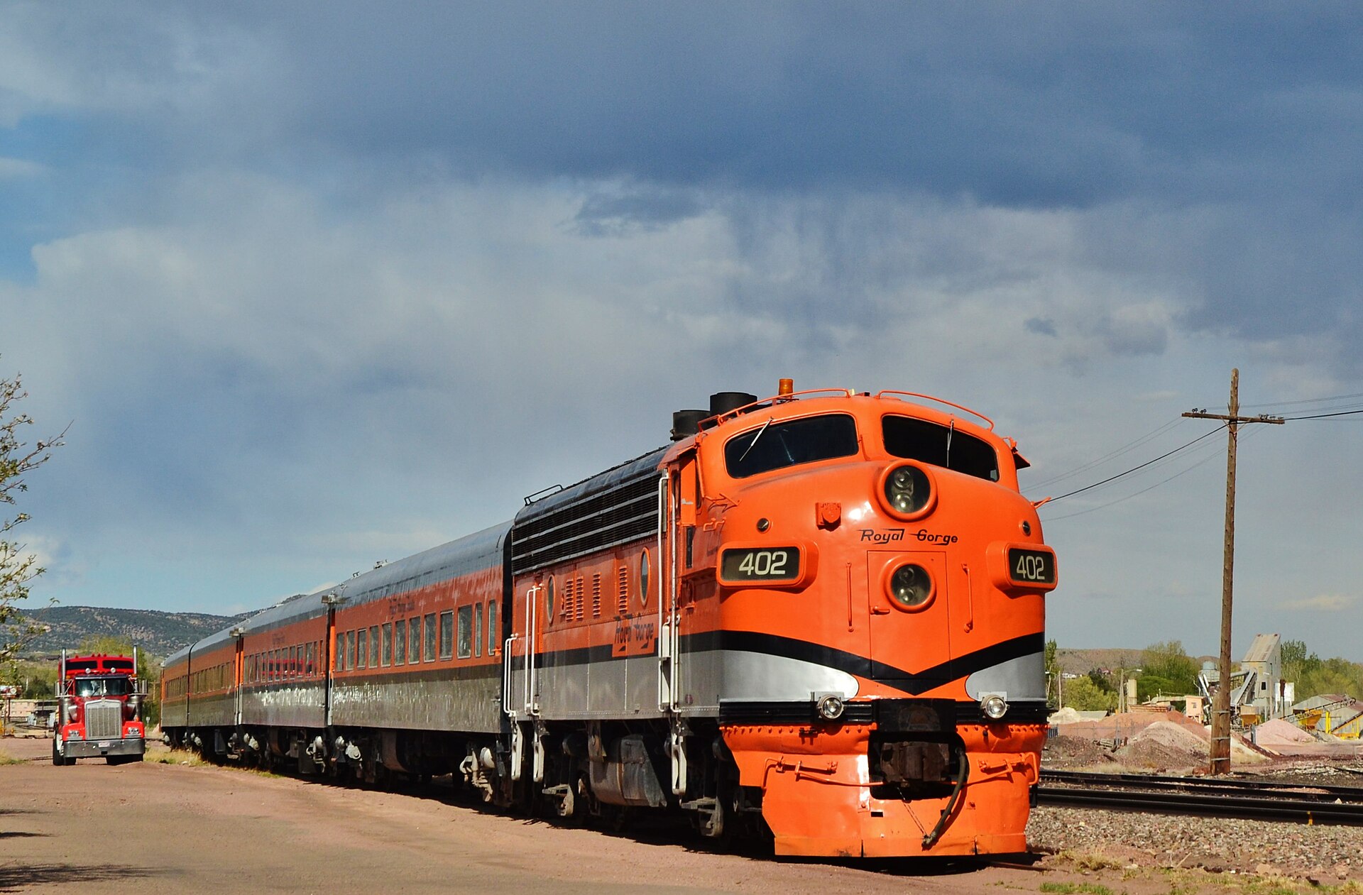 Orange Royal Gorge Route locomotive and passenger cars