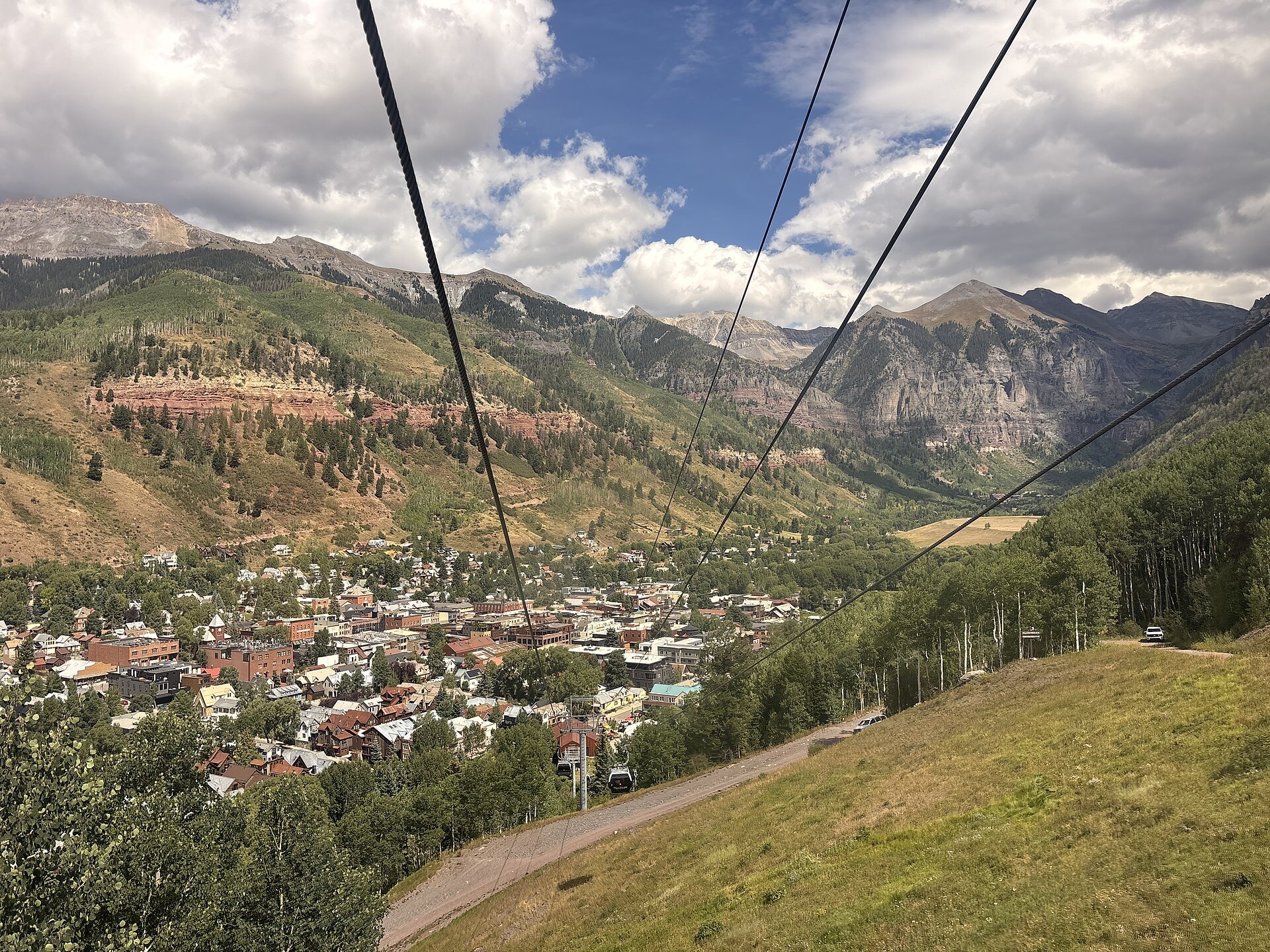Free Telluride Gondola cables descending toward the town of Telluride, Colorado