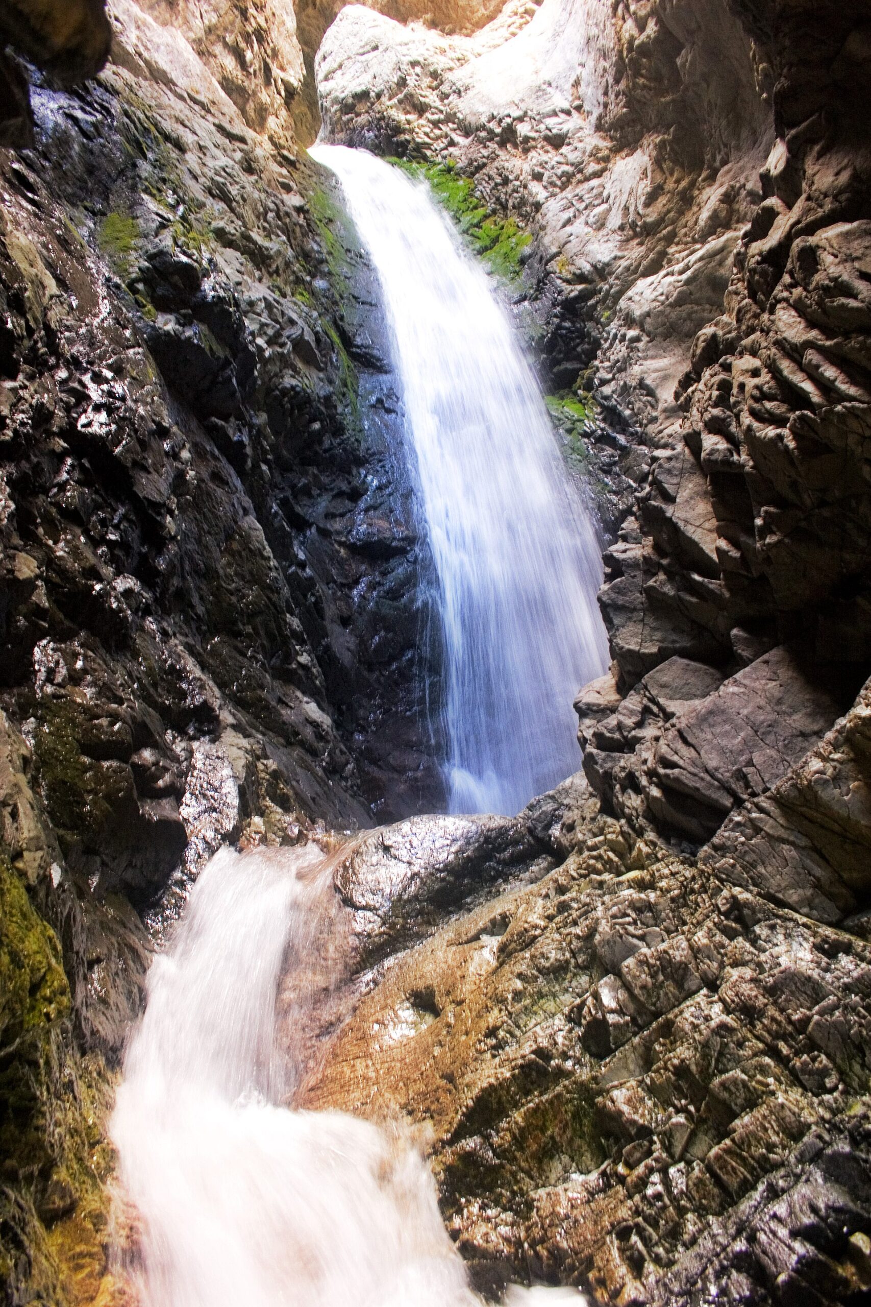 Zapata Falls pouring through its narrow rock crevice