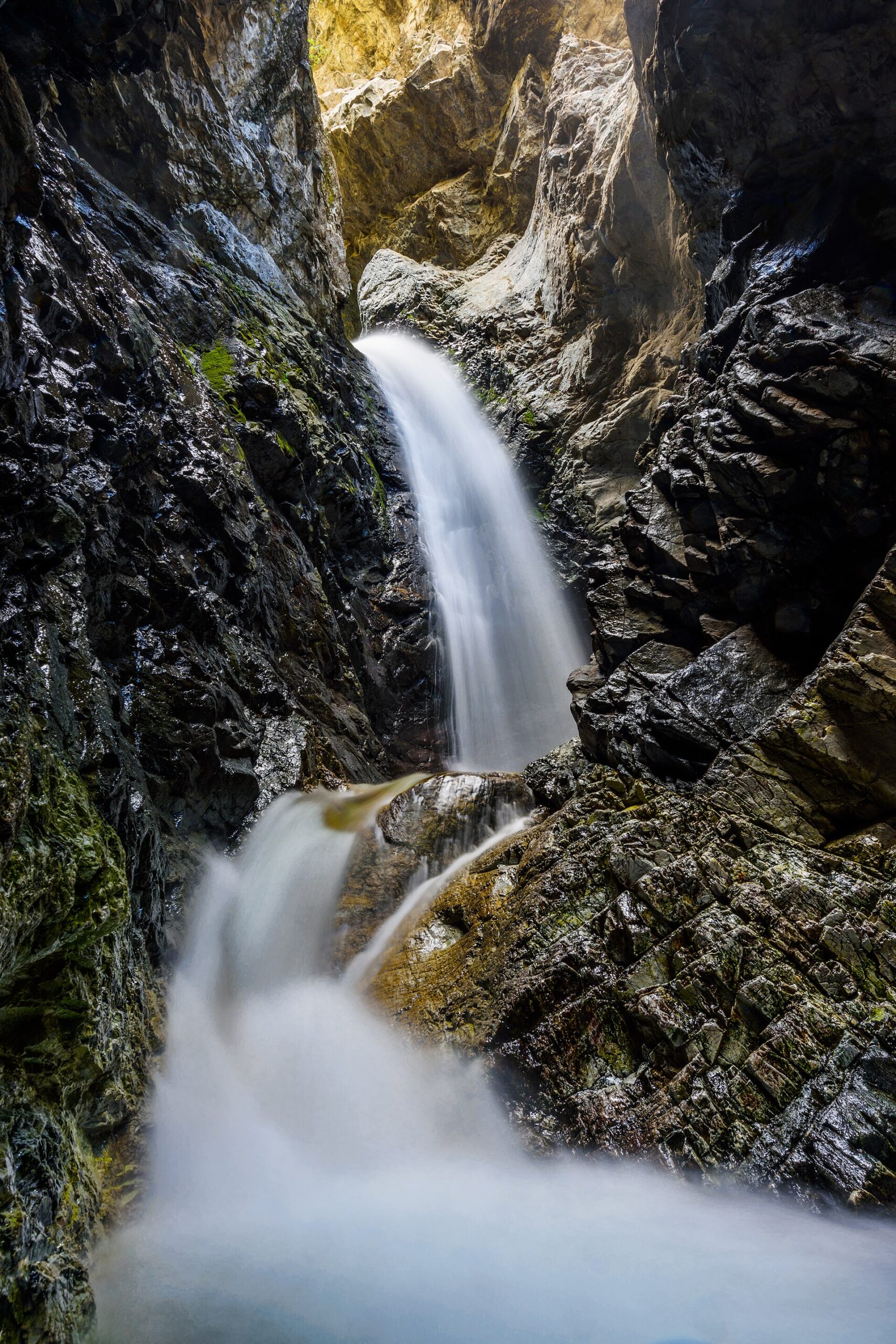 Zapata Falls cascading inside the canyon walls