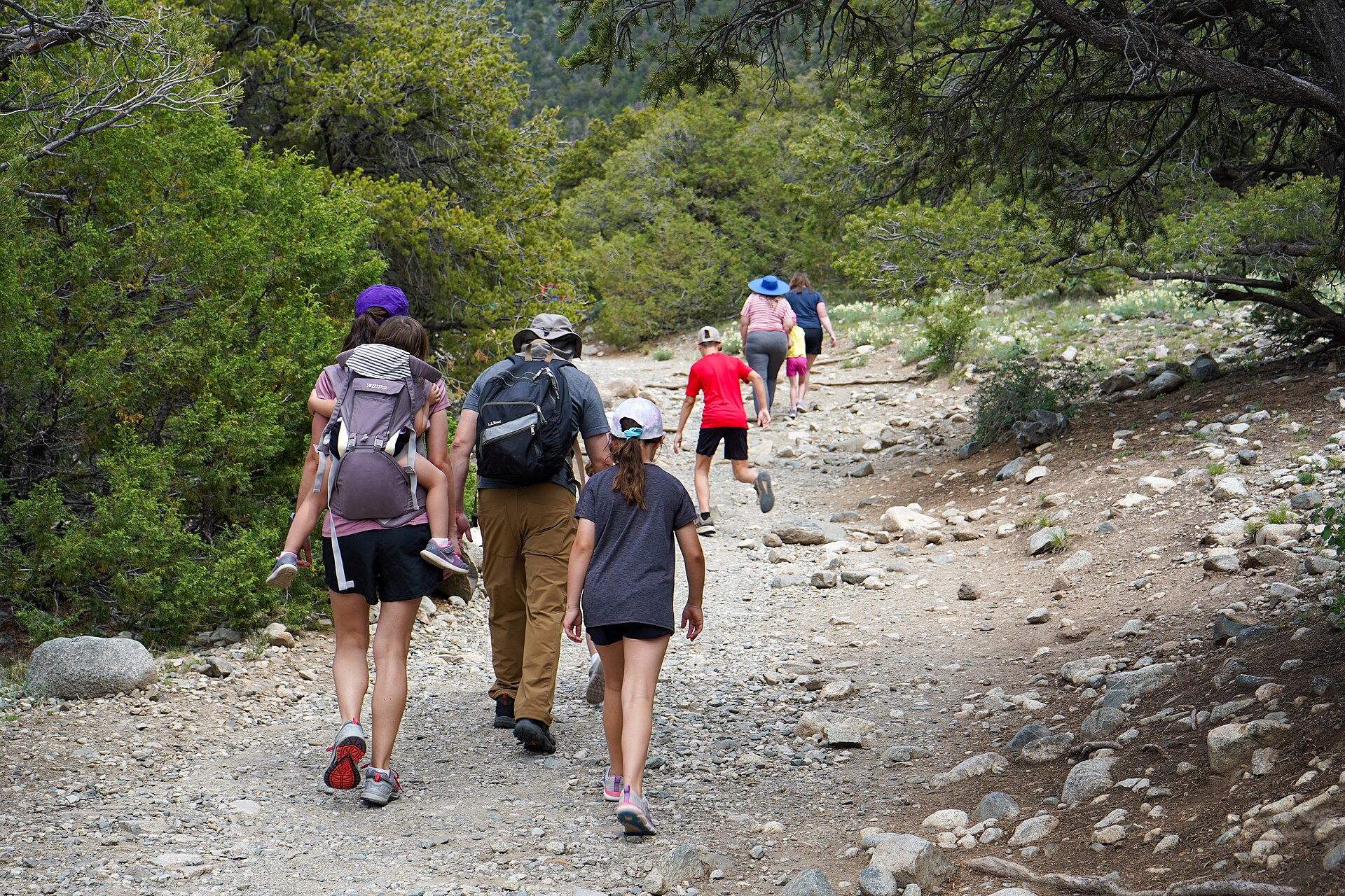 Family hiking the trail to Zapata Falls